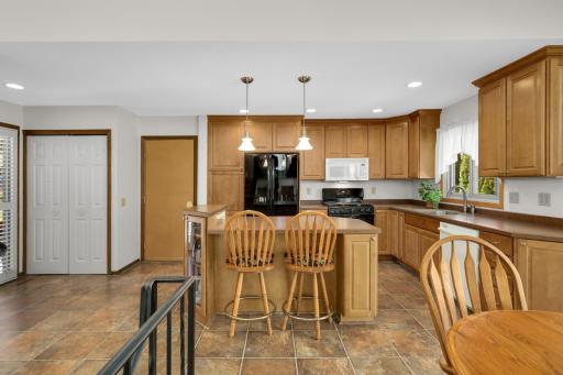 Kitchen with large center island and breakfast bar.