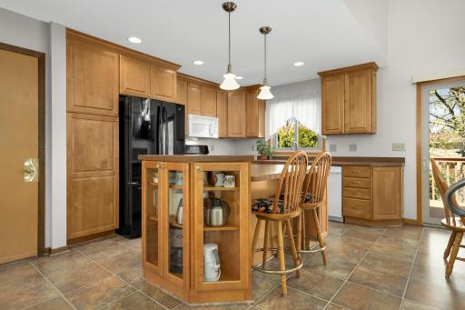 Warm maple cabinetry brings a timeless, welcoming warmth to the heart of the home.