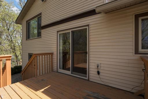 Walkout to wood deck from eat-in kitchen.