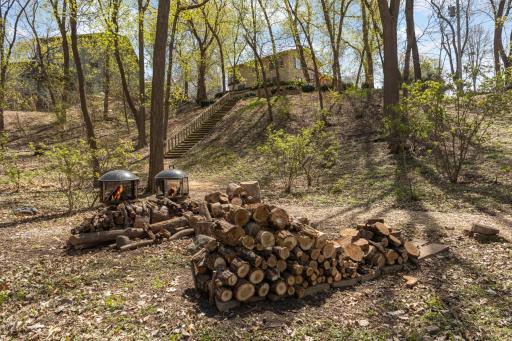 Railroad tie stairway connects to the lower backyard area on the expansive .5+ acre lot.