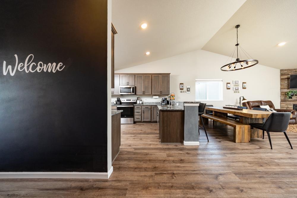 The soaring ceiling and large windows create a warm, welcoming atmosphere