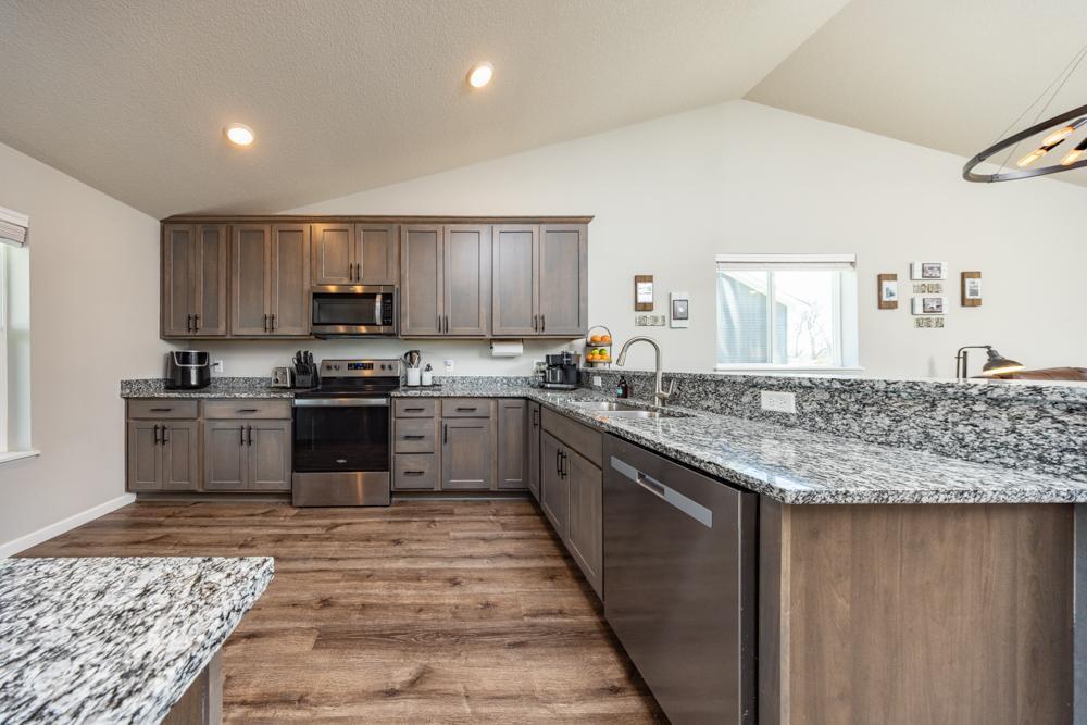 The kitchen opens to the dining room and family room