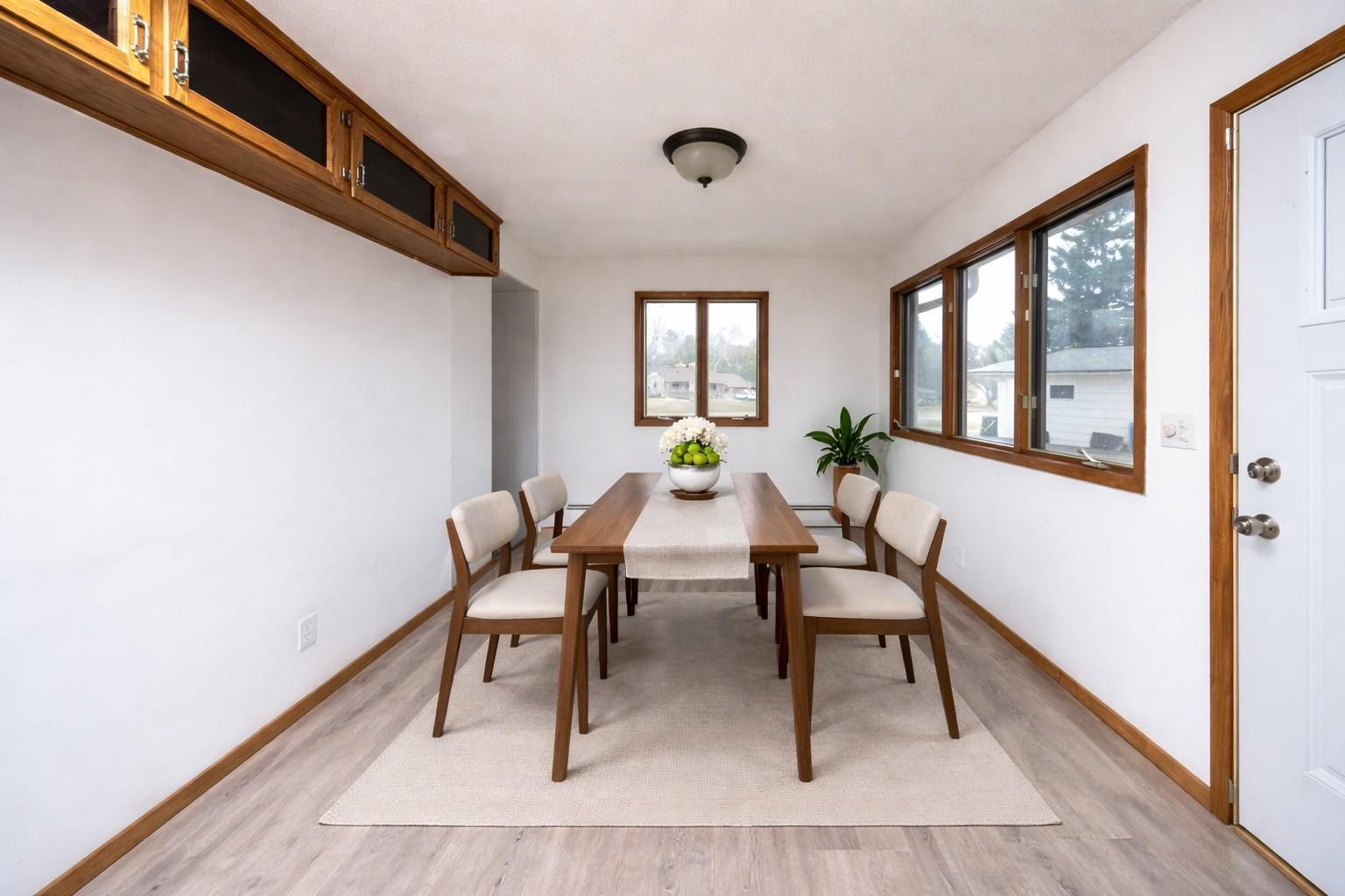 Tons of natural light in the dining room. Virtually staged photo
