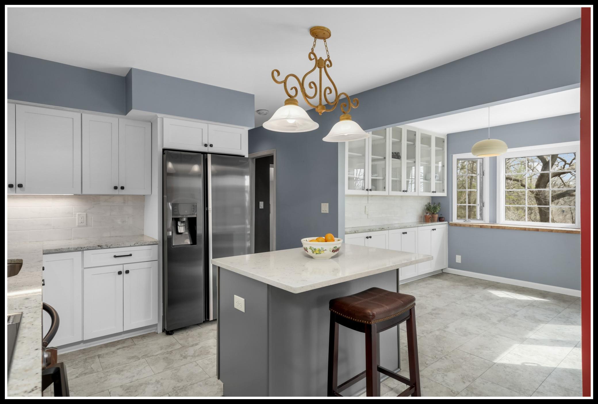 New flooring runs through the kitchen and into the informal dining area