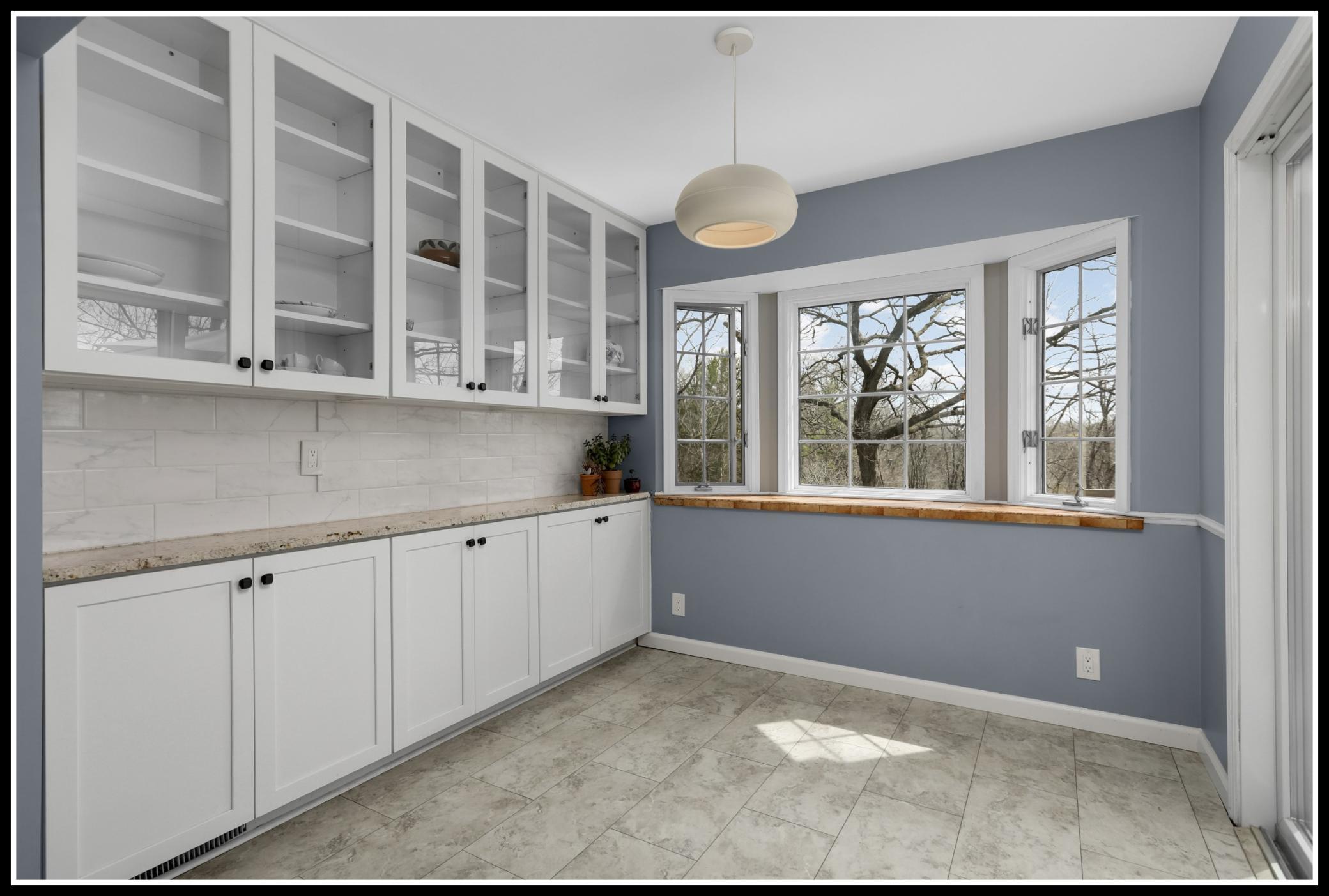 The informal dining area walks out to the large deck (door at right)