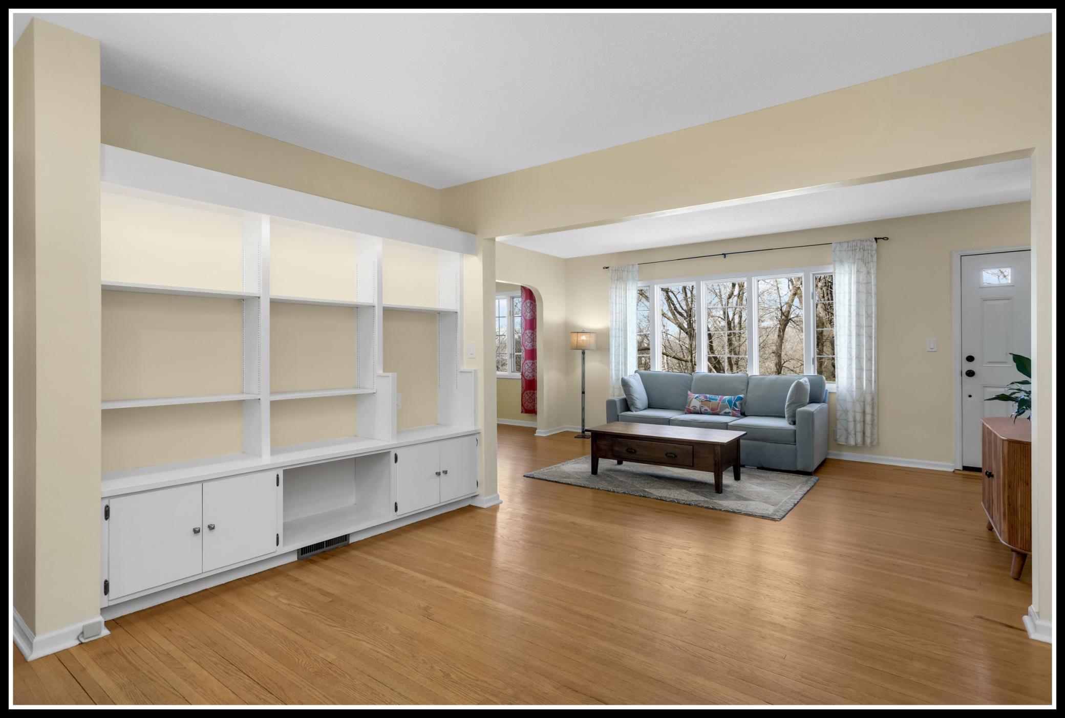 A sitting room with a wall of built-in storage and display makes a great flexible space: library, media set-up, family room, whatever you can envision!