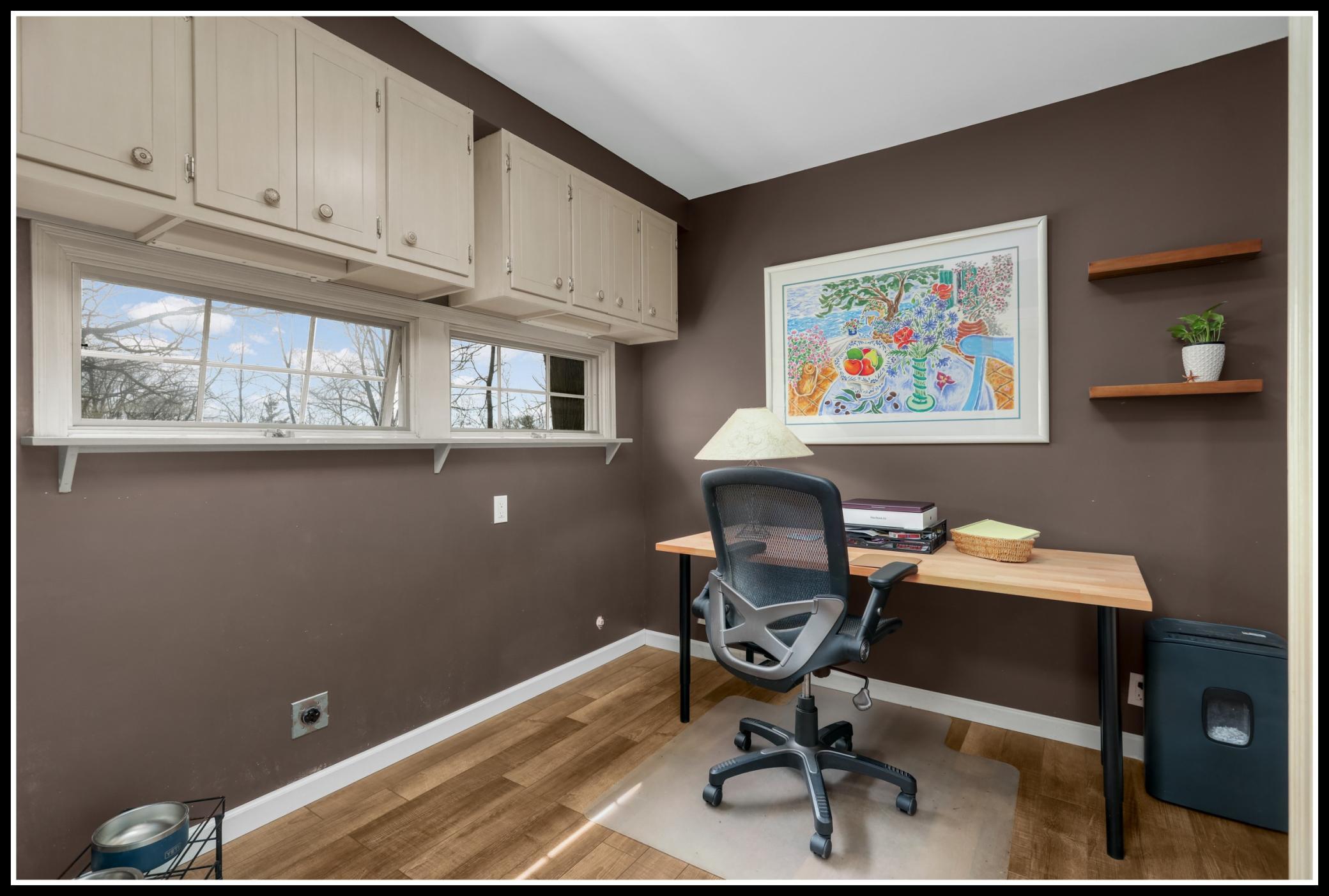 Another part of the 1980s addition, an office sits just off the entry on the main level.