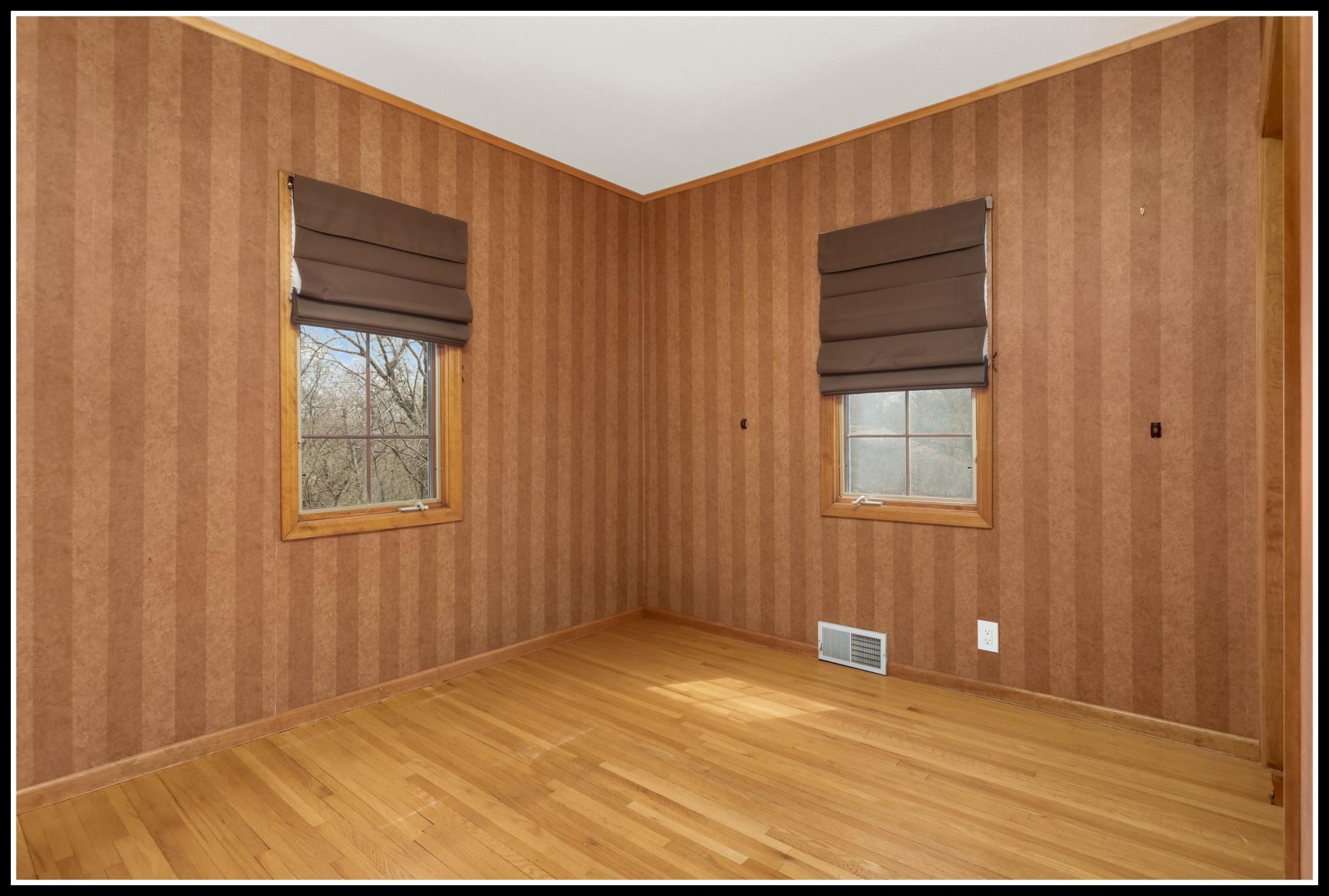 Second of two bedrooms on the main level with original hardwood floors