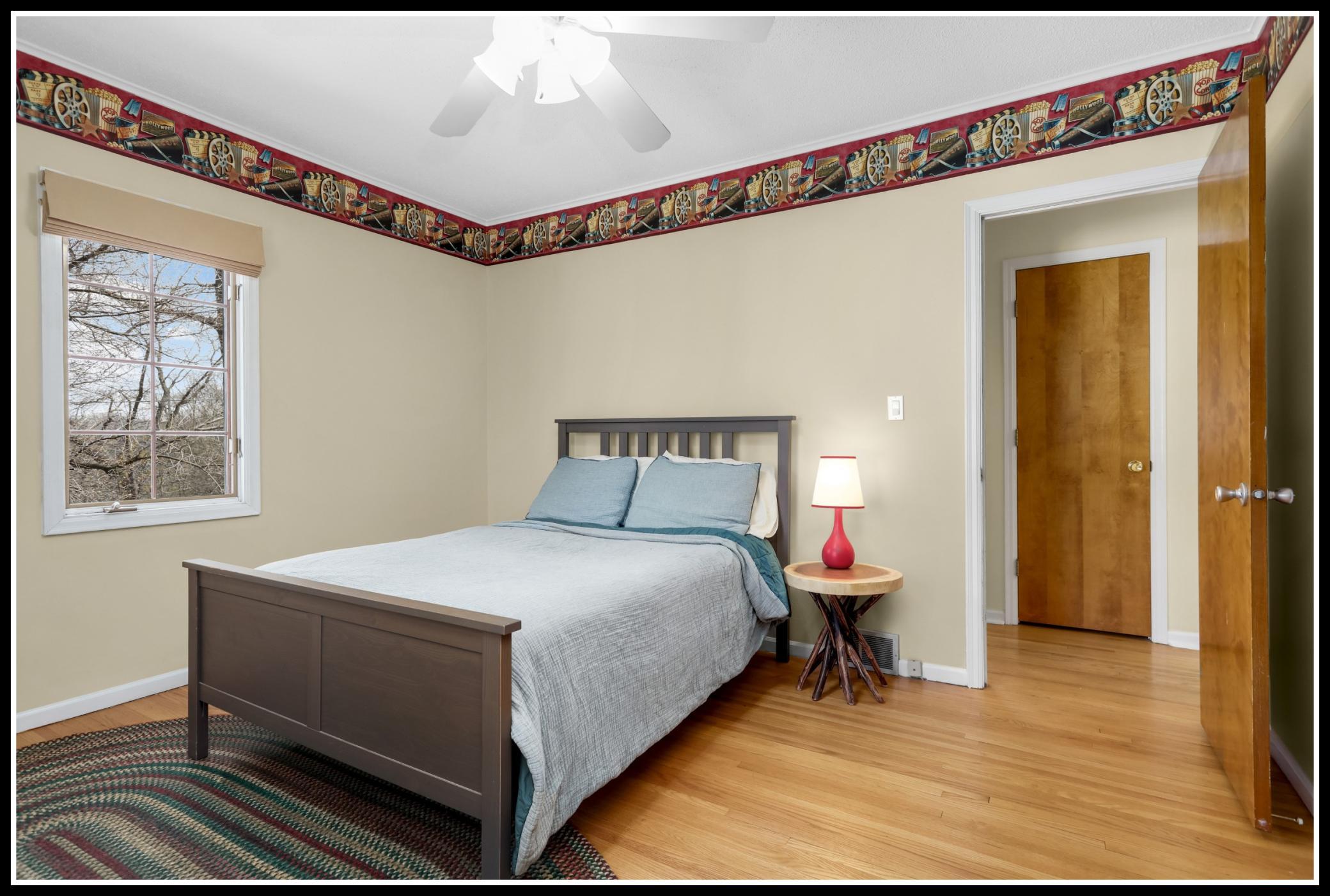One of two bedrooms on the main level with original hardwood floors