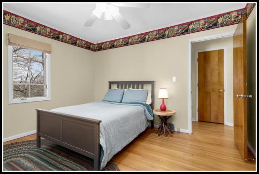 One of two bedrooms on the main level with original hardwood floors