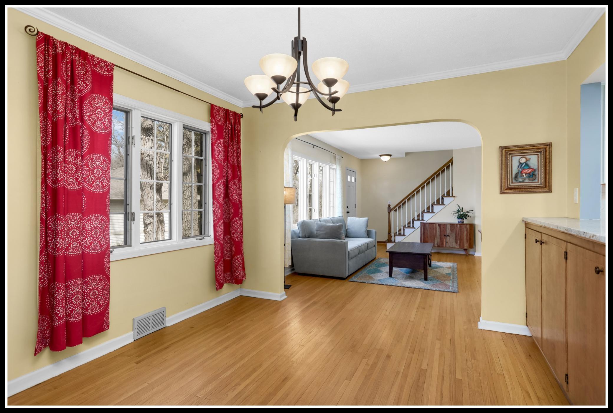 Dining room shares the wooded views of the living room