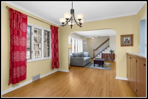 Dining room shares the wooded views of the living room