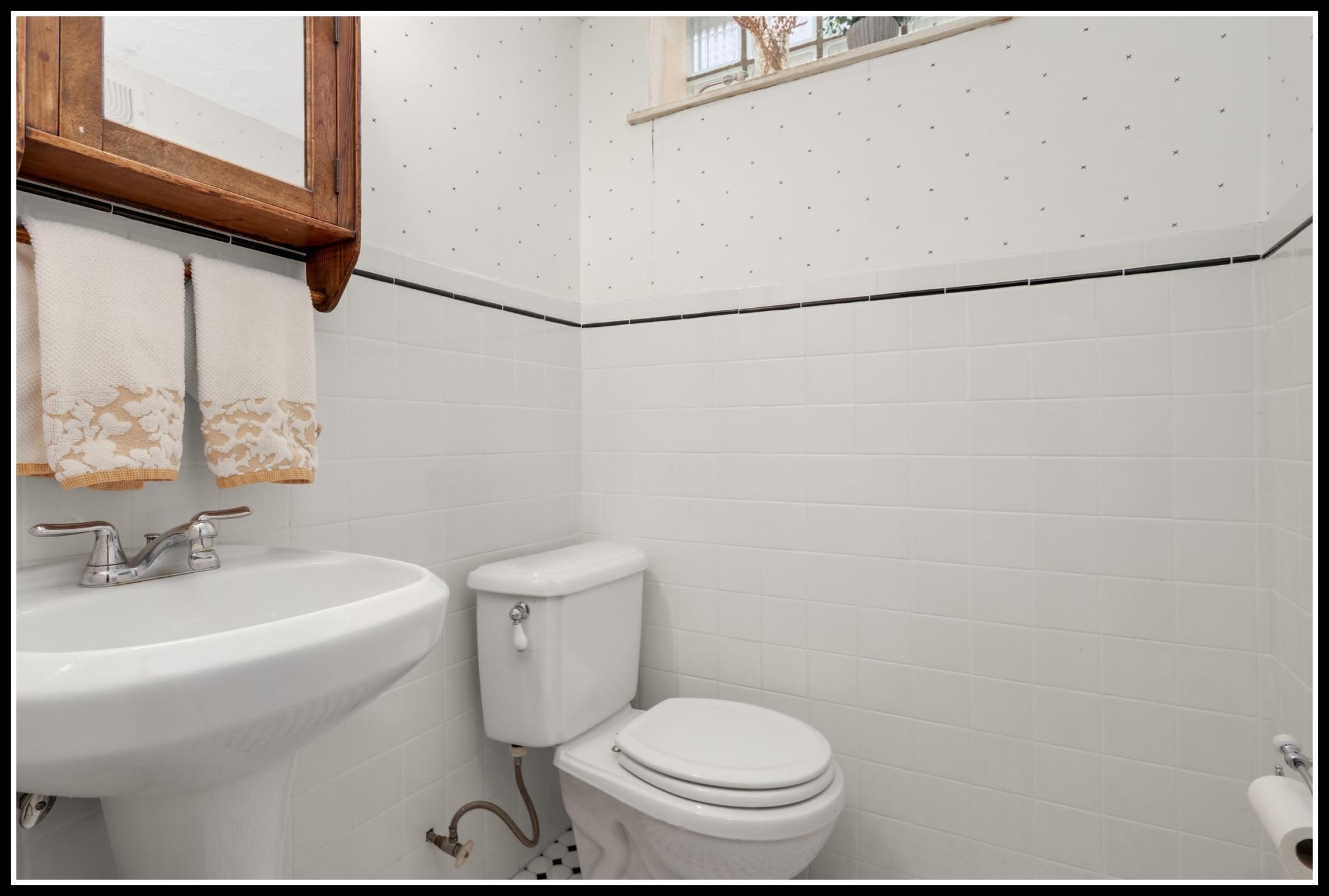 A half bathroom serves the lower level