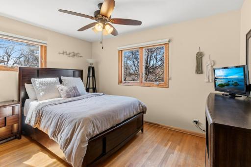 The Primary Bedroom features hardwood floors and a ceiling fan.