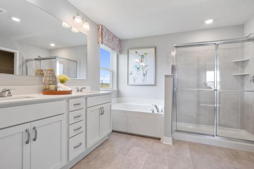 Primary bathroom get-away! Photo of prior model home, colors and finishes will vary.
