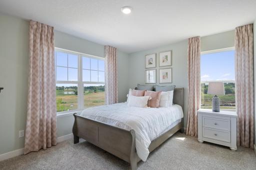 Upper level bedroom. Photo of prior model home, colors and finishes will vary.