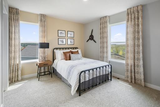 Upper level bedroom 4. Photo of prior model home, colors and finishes will vary.