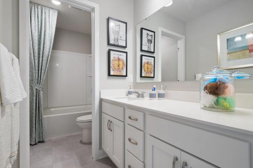 Upper level offers a spacious hall bathroom. Photo of prior model home, colors and finishes will vary.