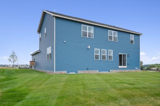 We offer walkout home sites as well. Sod and irrigation included. Photo of prior model home, colors and finishes will vary.