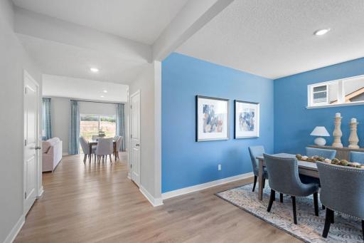 Spacious halls connecting dining room to kitchen.