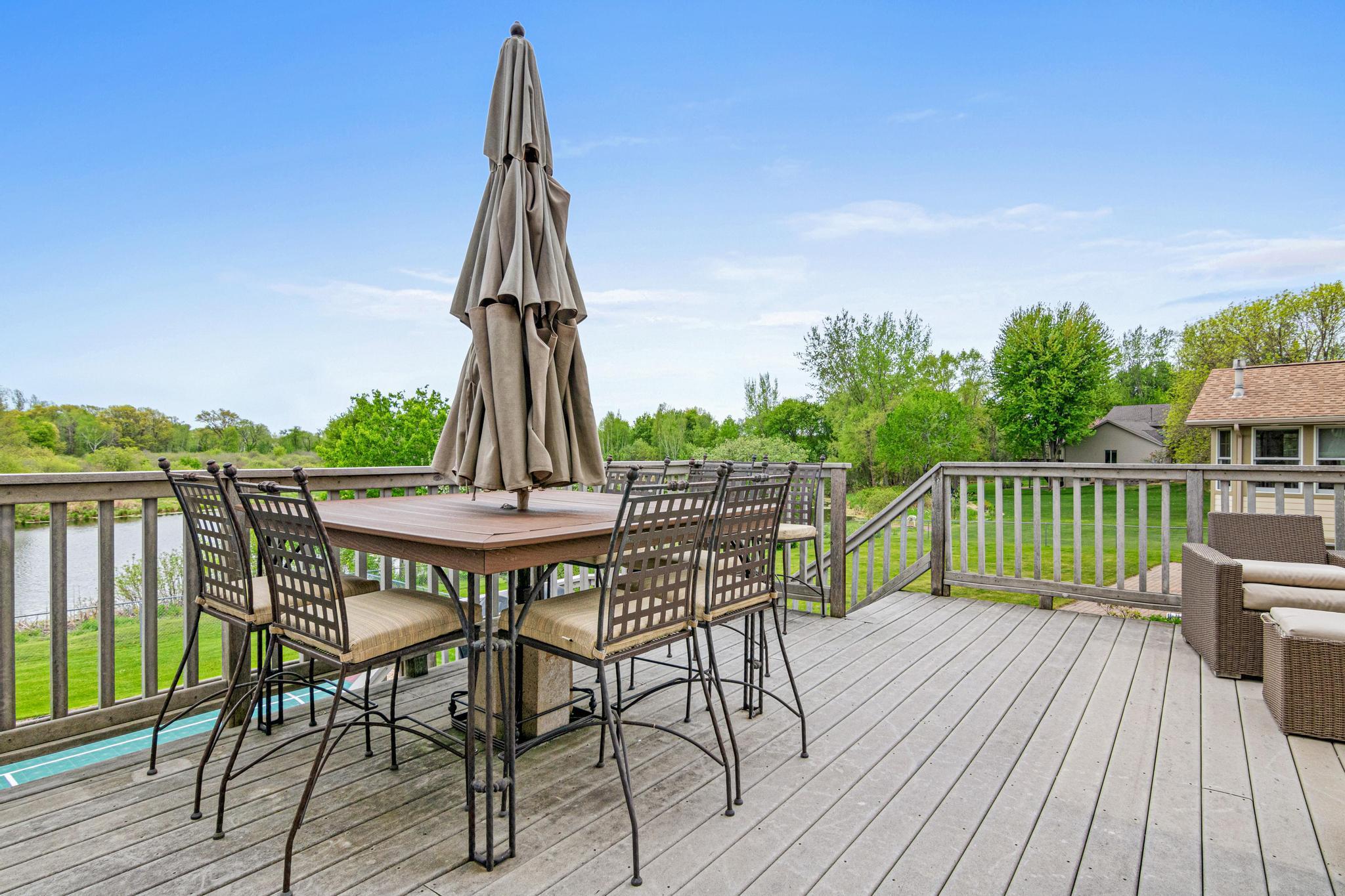 Enjoy the east-facing sunrises overlooking nature. There is plenty of wildlife and birds to enjoy. This table, chairs and umbrella will stay with the home.