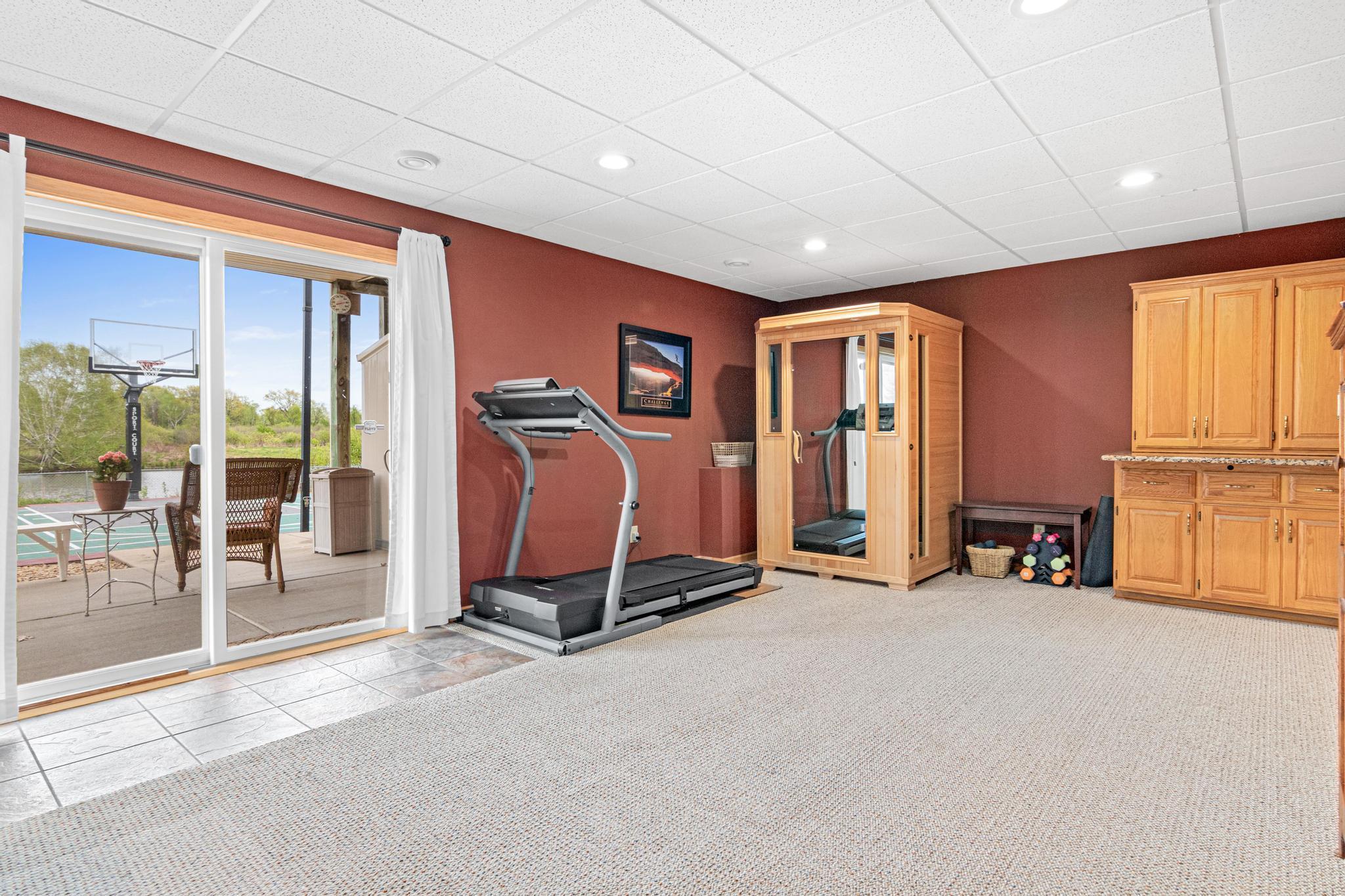 The end of this lower-level family room creates space for kids' play, a future kitchenette, etc.
