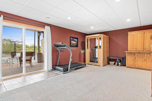 The end of this lower-level family room creates space for kids' play, a future kitchenette, etc.