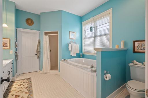 Jetted tub and huge walk-inshower off the primary bedroom!