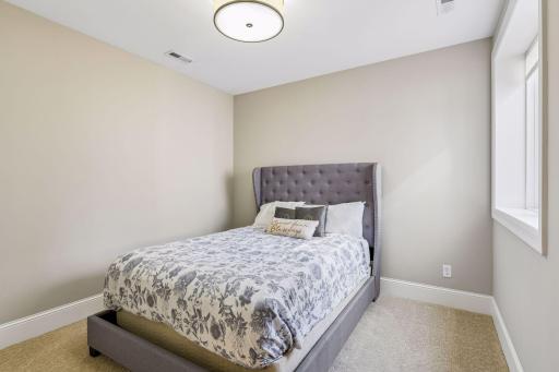 The lower level fifth bedroom is ideal for guests or could be used as a craft room
