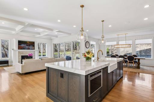 The center island provides a wonderful gathering space for family and friends