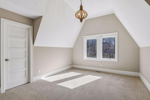 The second bedroom measures 15x12 and has a vaulted ceiling