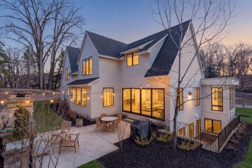 The west facing backyard has a 21x15 patio with a stone fireplace nestled among the trees