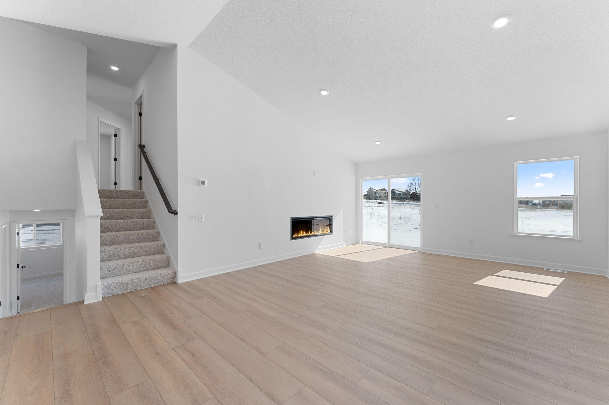 Airy and inviting, the Great Room is ideal for watching movies with the family and hosting special celebrations with guests. Open the adjacent glass-sliders to invite a refreshing breeze throughout the home.