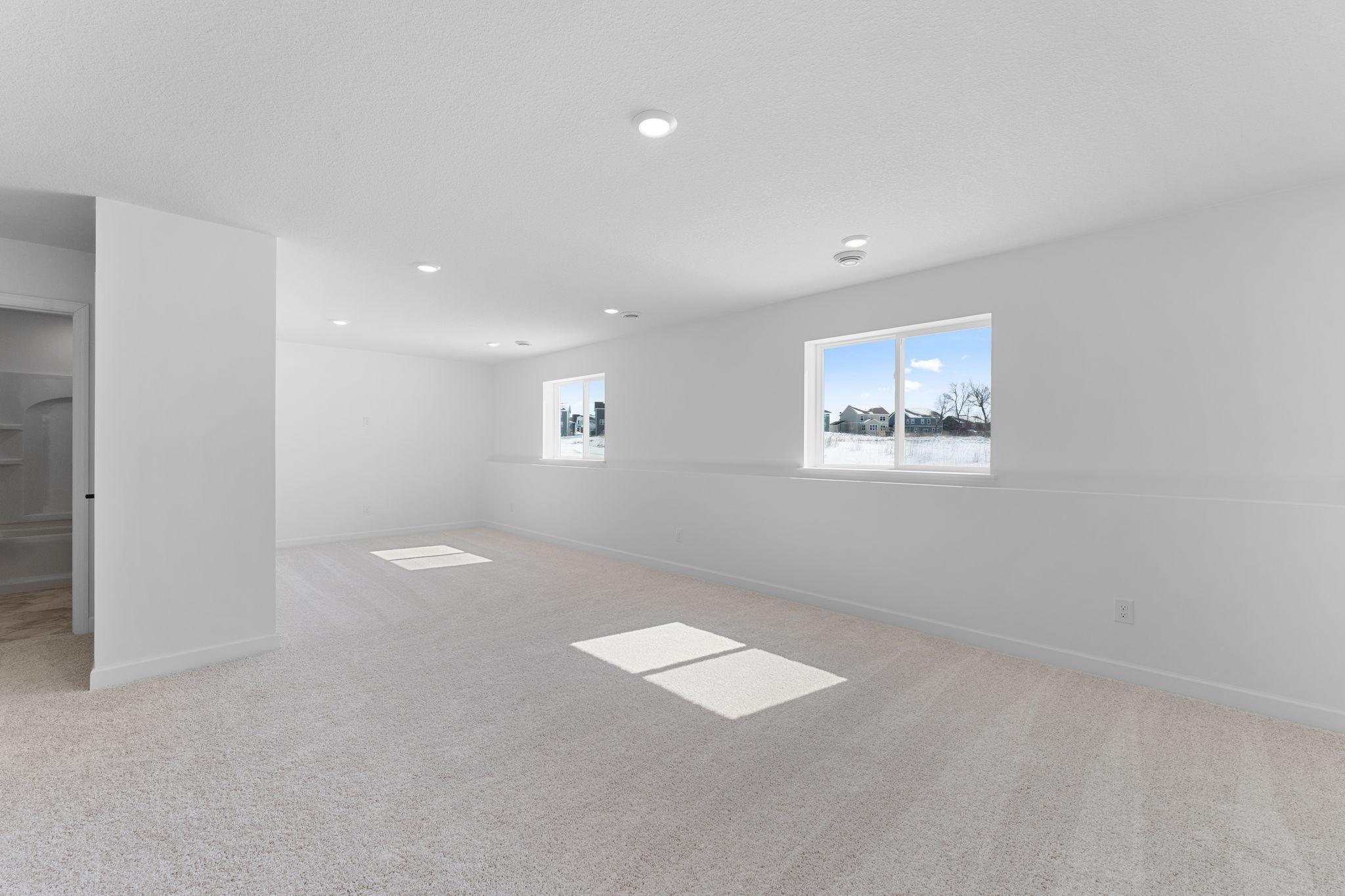 The finished basement offers enhanced versatility with a recreation room and a secondary bedroom, with the addition of a laundry closet and another full-sized bathroom.