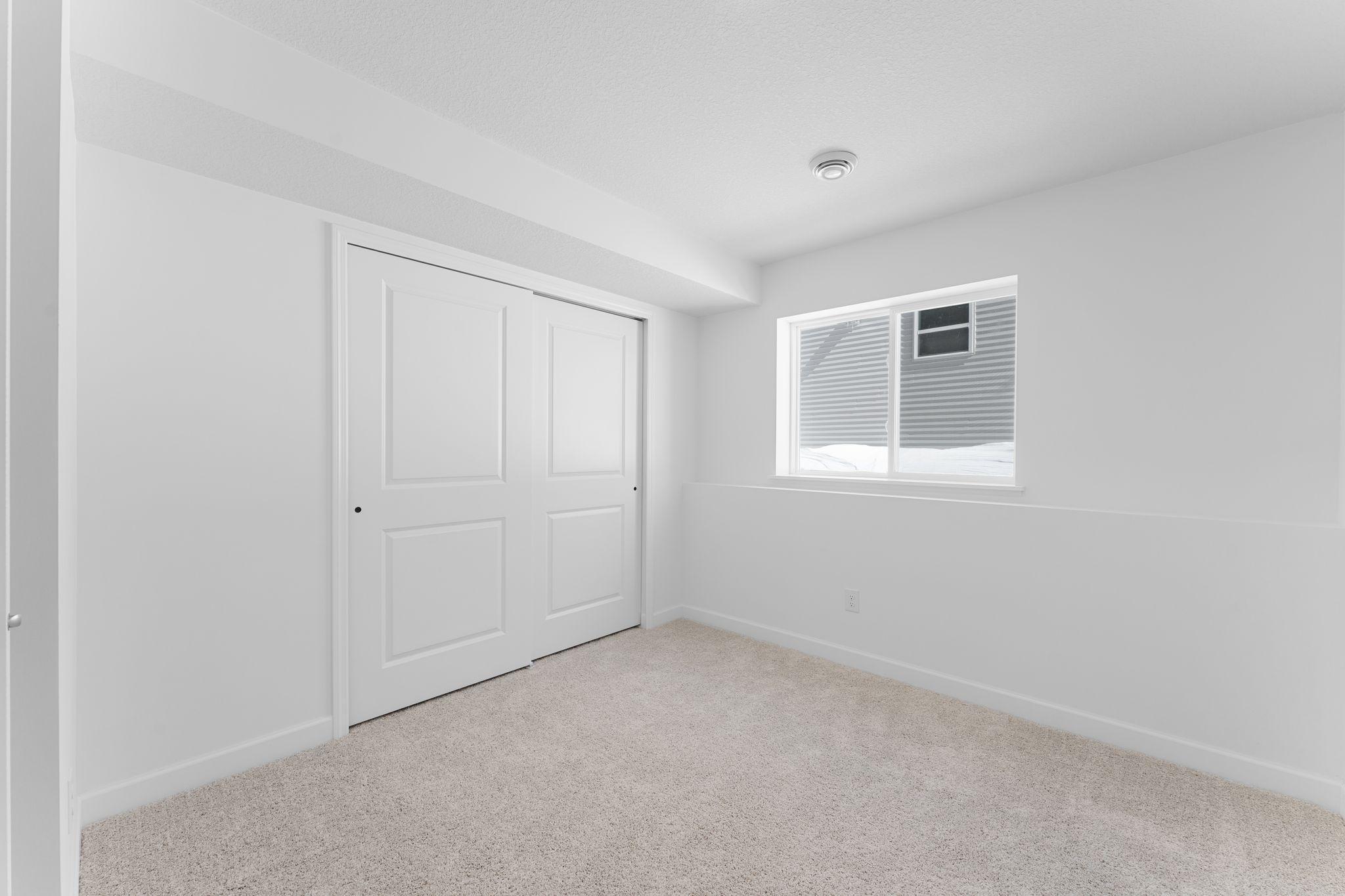 An additional secondary bedroom is included in the finished basement