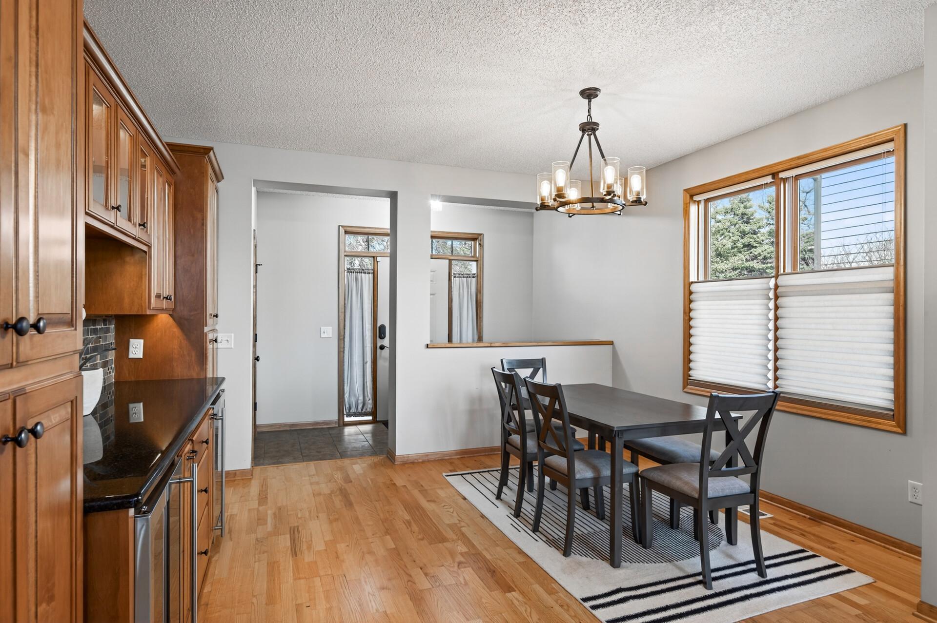 Built-in cabinetry with dual beverage coolers adds both function and upscale appeal.