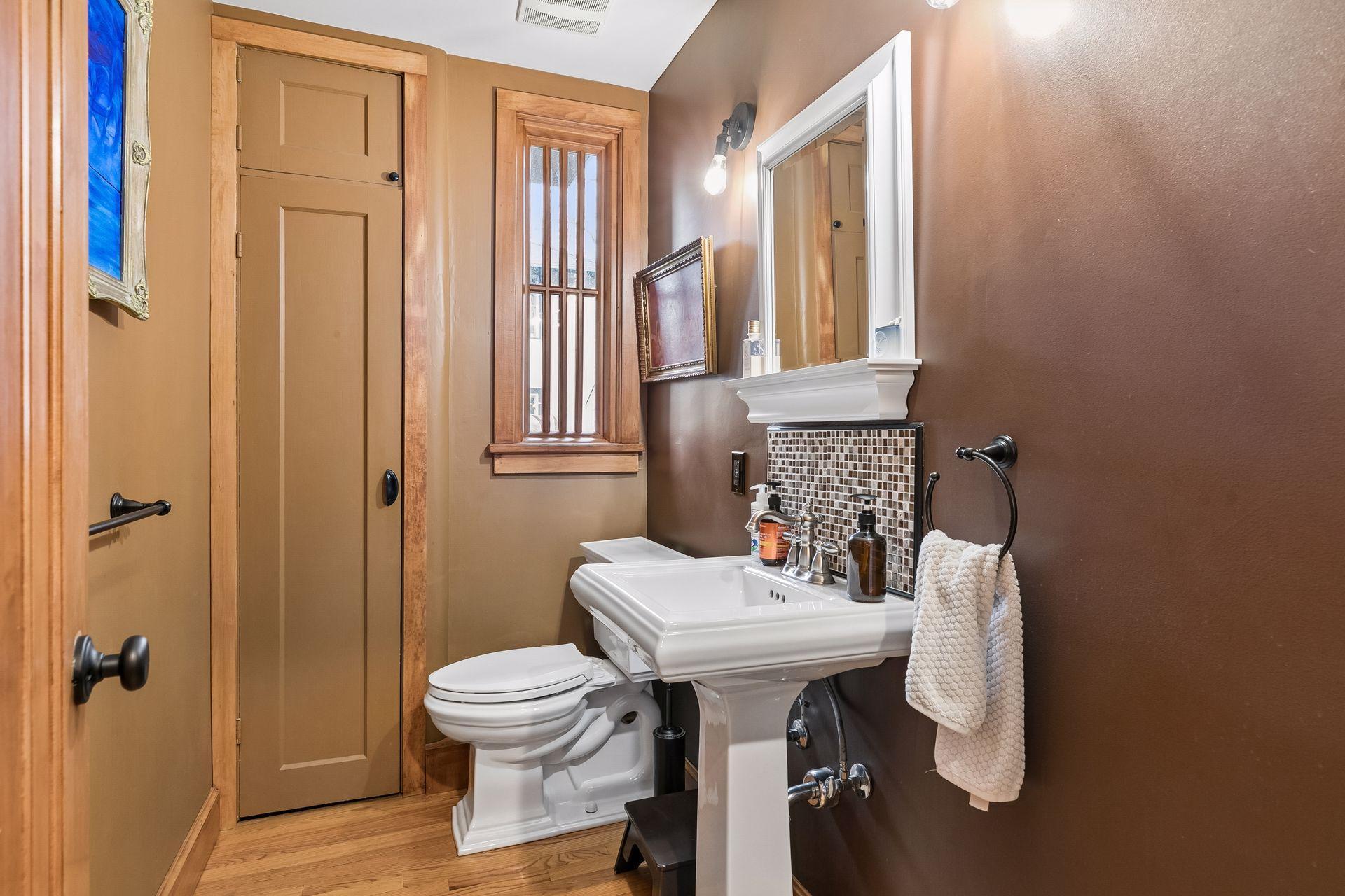 First floor half bath between kitchen and dining room