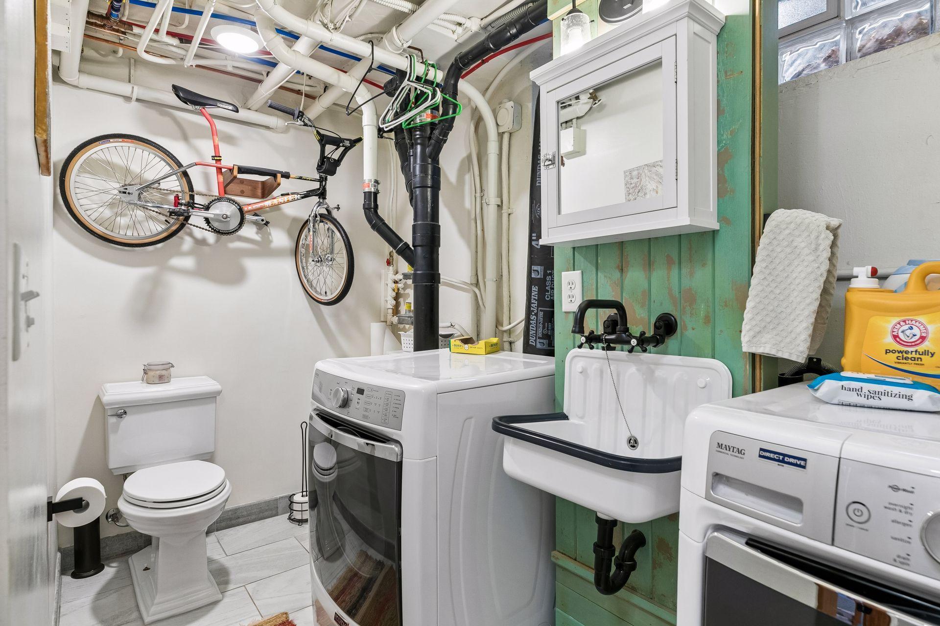 Lower level combo bath and laundry room - state of the art washer and dryer
