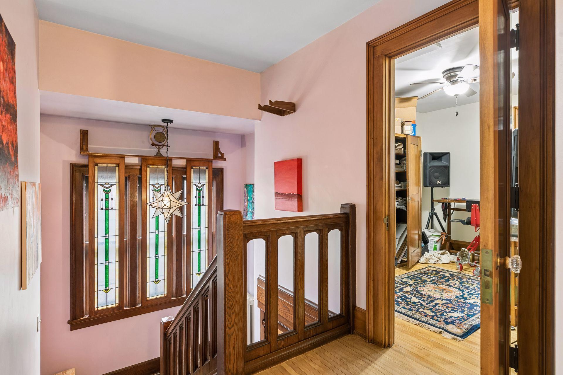 Landing and railing at the top of the steps - on stairs are custom carpet runners put in 2021