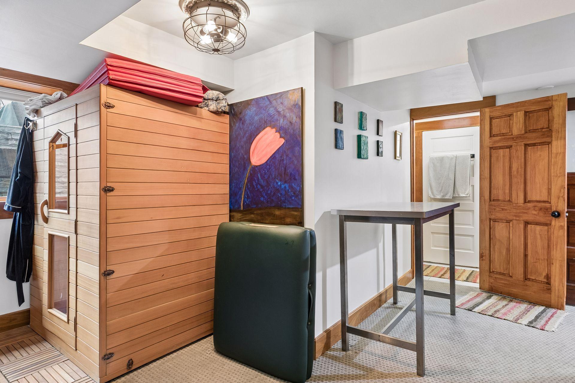 Lower level bedroom with egress window has bath and sauna
