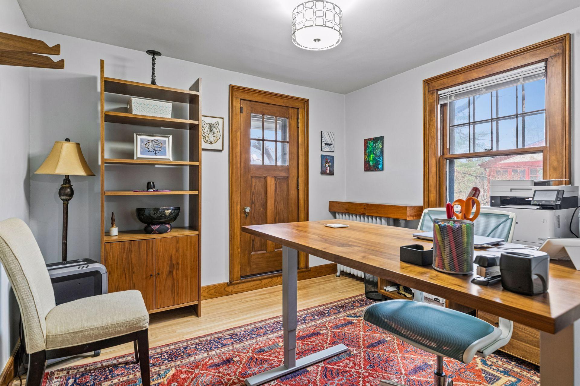 Upper level bedroom currently used as an office - door to small porch for air flow