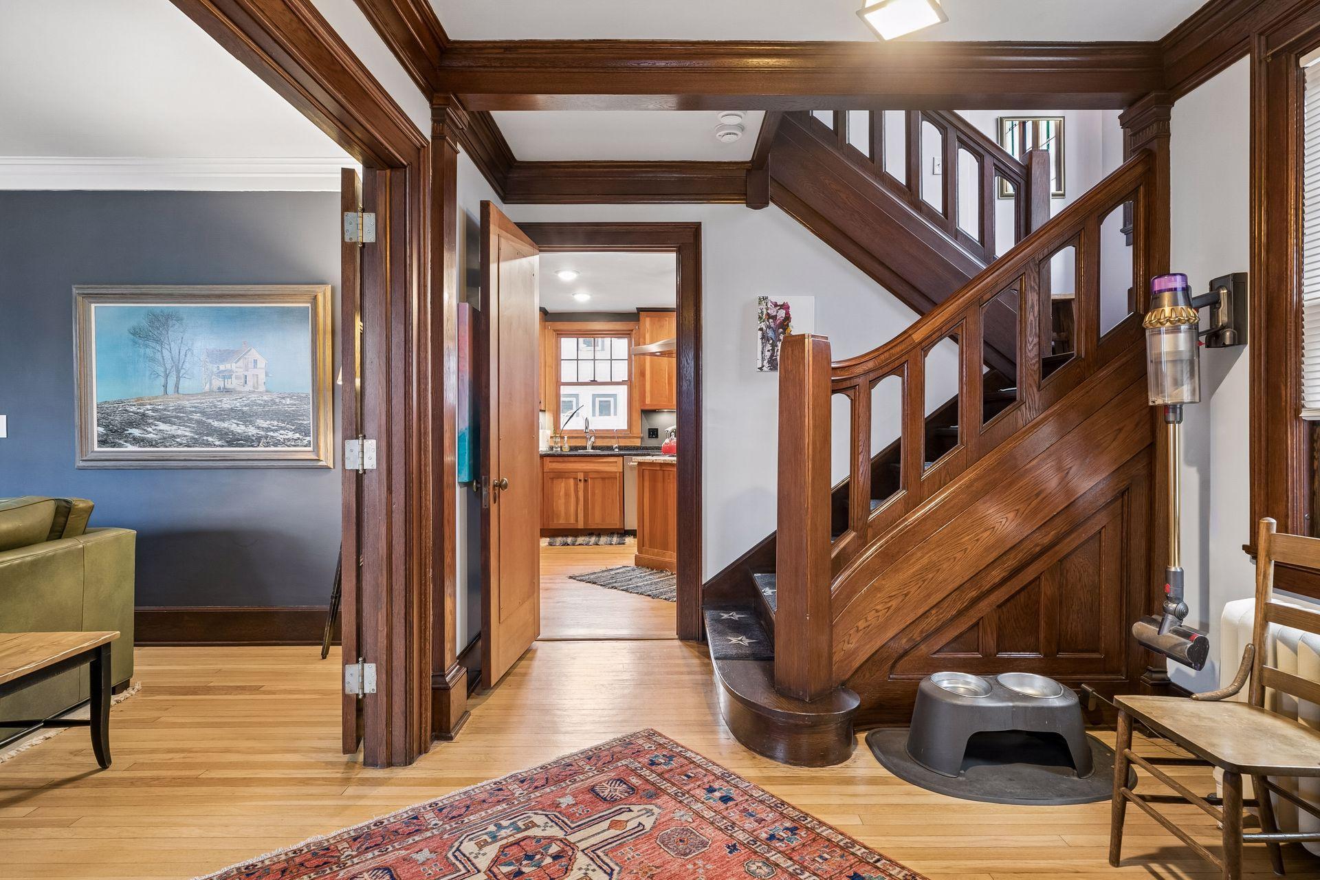 Entering from the foyer living room to the left - kitchen entrance ahead and stairs to second floor
