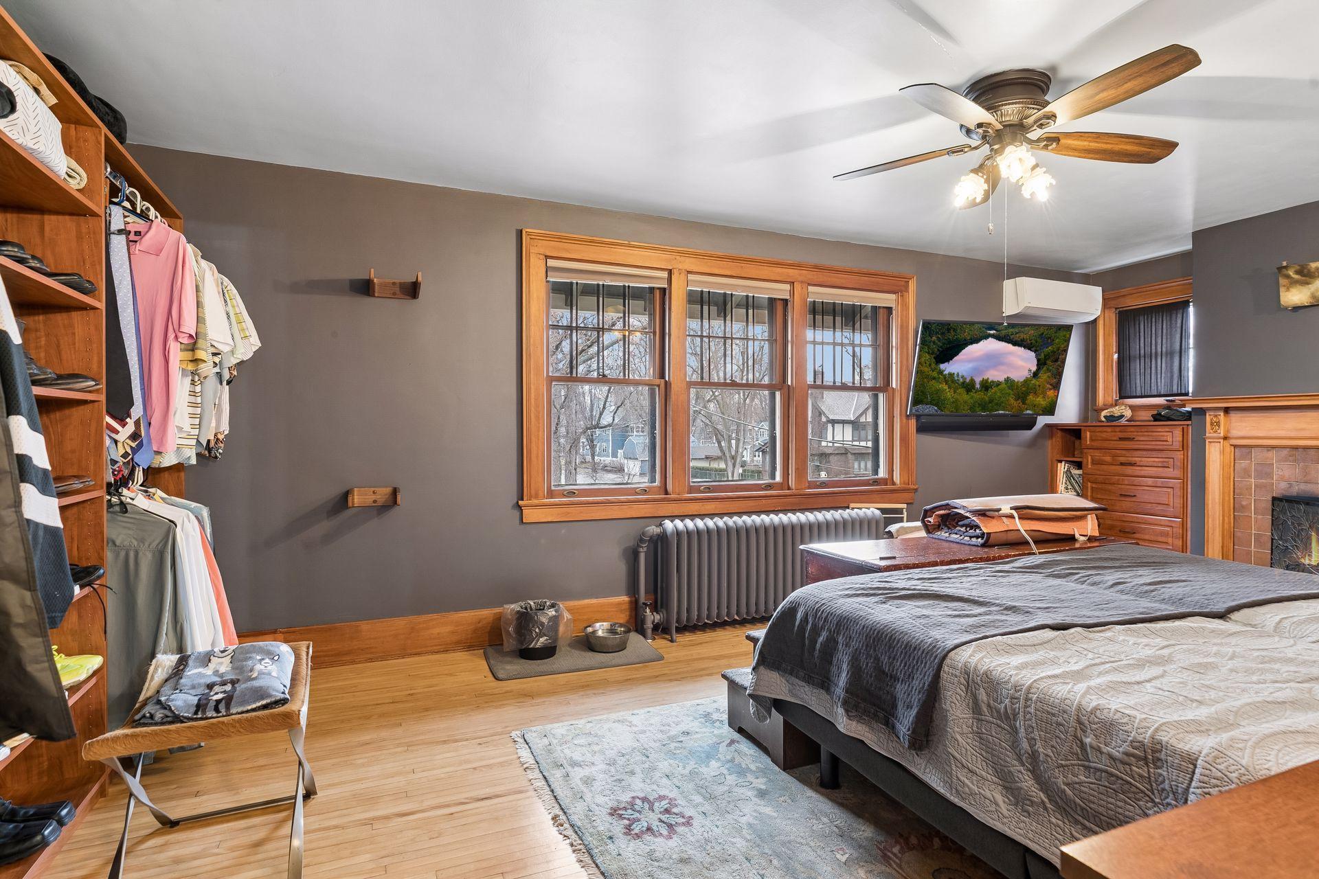 Primary bedroom with woodburning fireplace - Closet by Design wall and primary closet