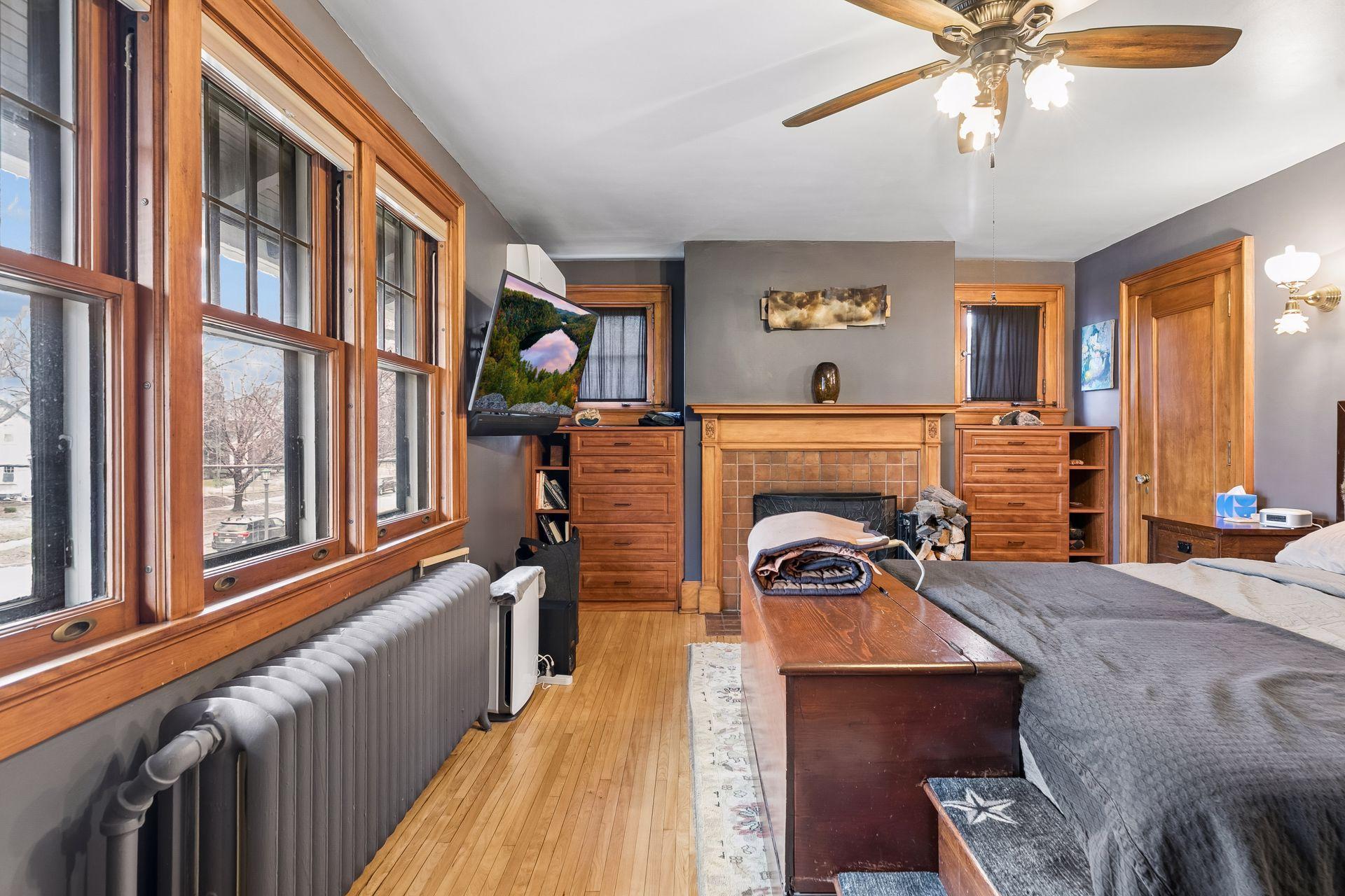 Primary bedroom with woodburning fireplace closet door to the right