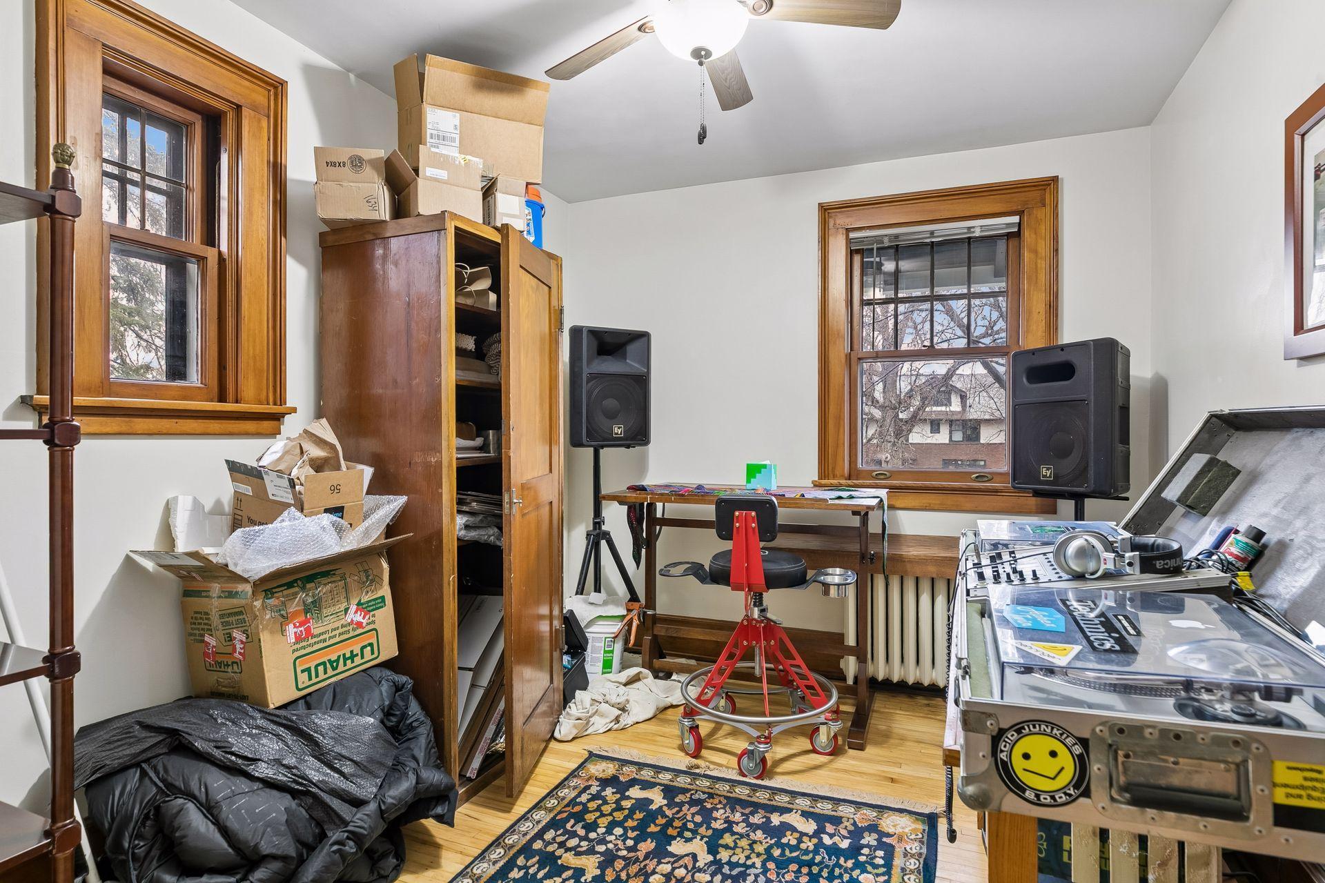 Upper level bedroom used as music room and artists studio -