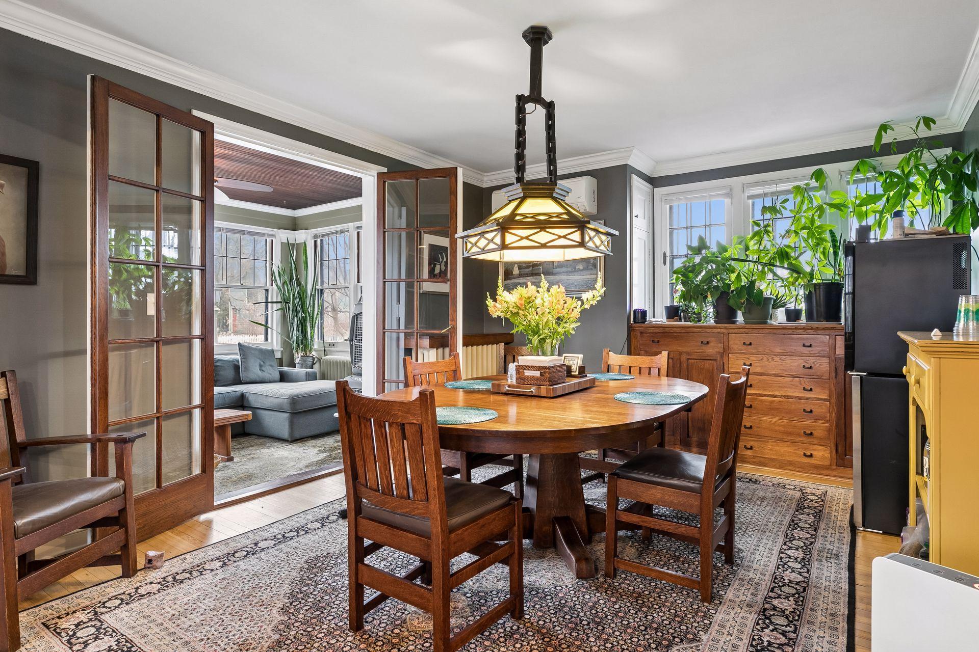 Large gracious dining room with vintage Craftsman ceiling fixture - the built in buffet was found in the basement being used as a workbench and brought up and reinstalled