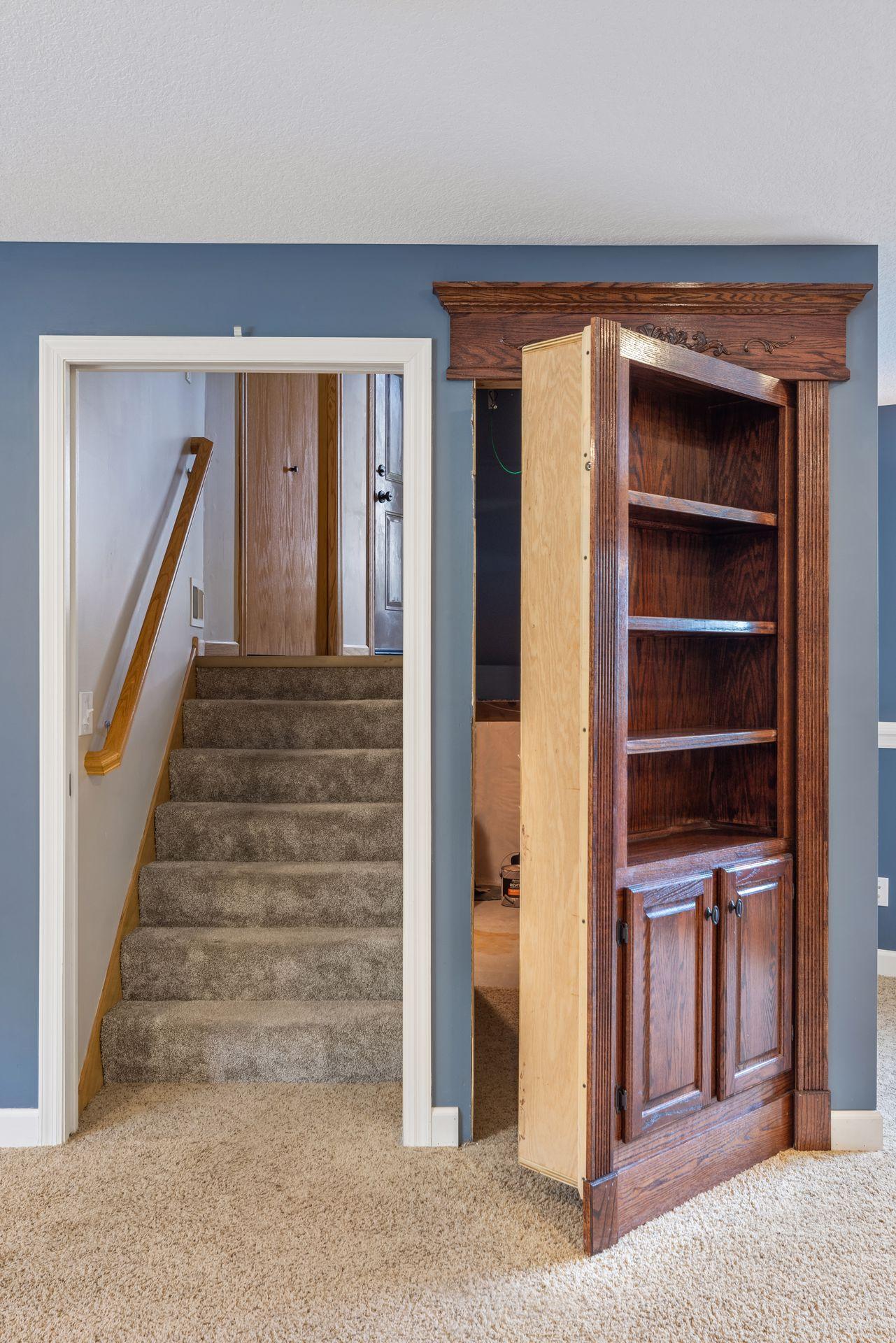 One of the home’s most unique features- Custom built-in bookshelf with a hidden doorway creates a truly one-of-a-kind feature, blending timeless craftsmanship with a touch of creativity and charm.