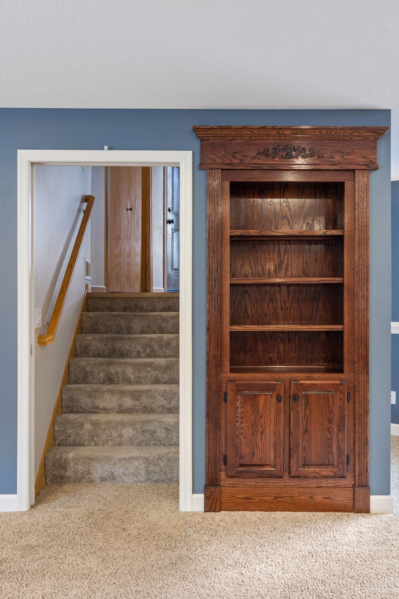 One of the home’s most unique features- Custom built-in bookshelf with a hidden doorway creates a truly one-of-a-kind feature, blending timeless craftsmanship with a touch of creativity and charm.