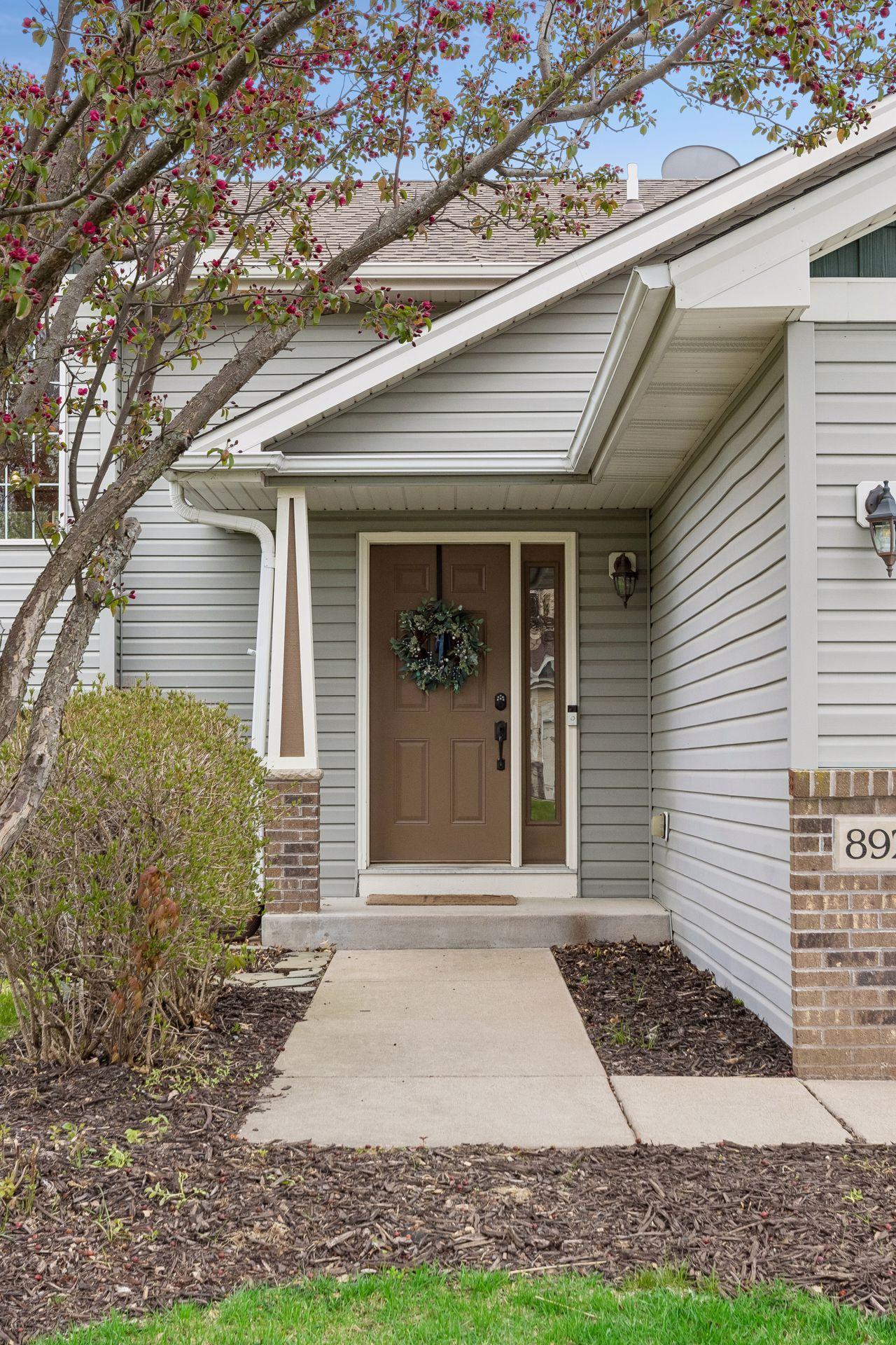 From the welcoming covered entry to the mature landscaping and blooming tree, this home makes a beautiful first impression before you even step inside.