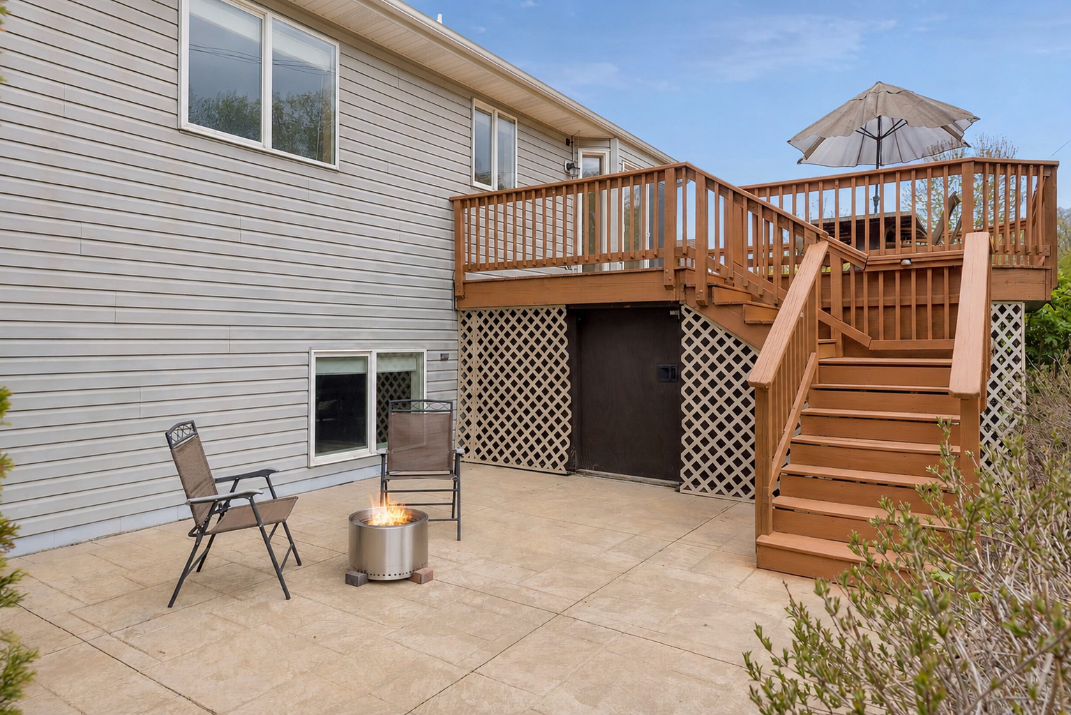 The lower patio creates the perfect spot to relax around a firepit or entertain guests all season long. Don't forget the bonus storage shed underneath the deck!
